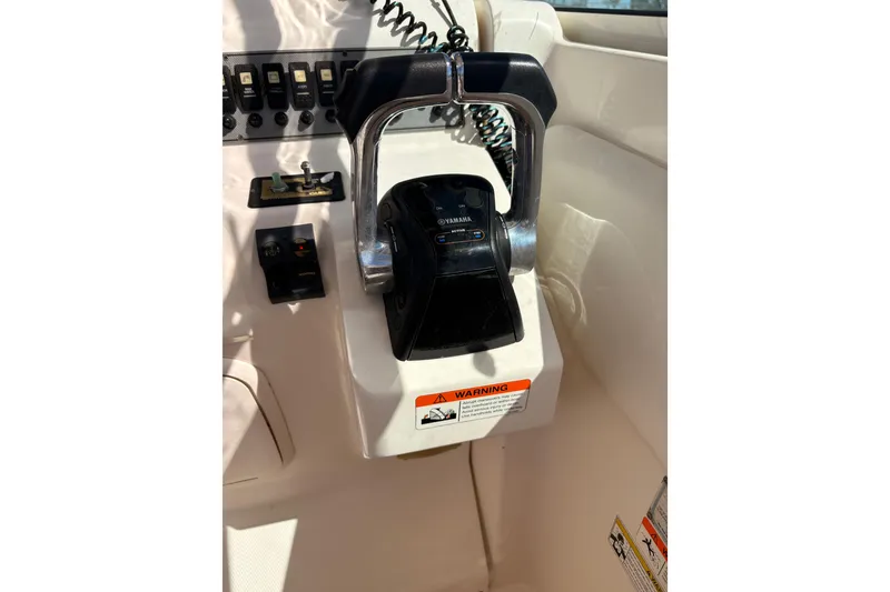 Slide: The Image of Close-up of 2015 Wellcraft 290 Coastal boat controls with Yamaha throttle. - 46