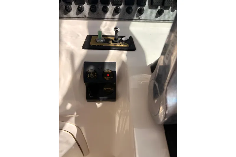 Slide: The Image of Control panel of a 2015 Wellcraft 290 Coastal boat, featuring switches and indicators. - 47