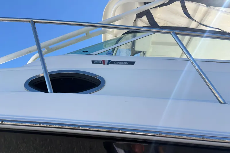 Slide: The Image of 2015 Wellcraft 290 Coastal boat with sleek design and stainless steel railings. - 60