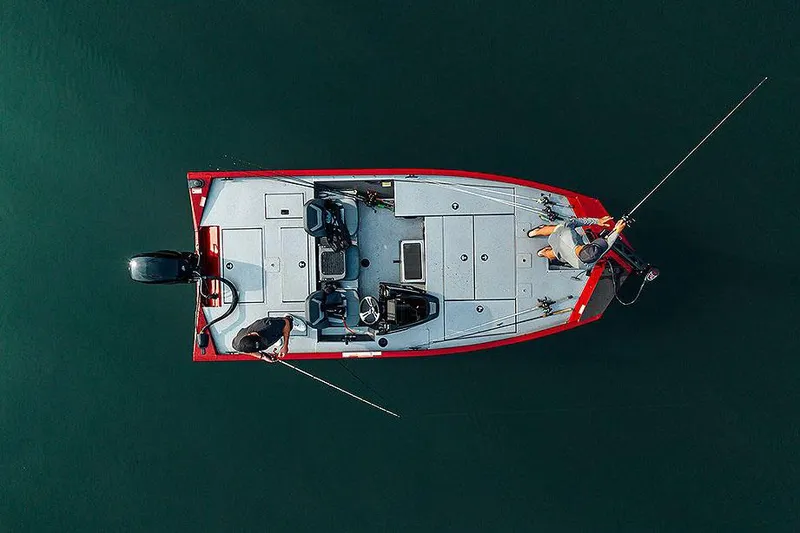 Slide: The Image of Manufacturer Provided Image: Aerial view of 2025 Lowe Stinger 175C fishing boat on calm water. - 6