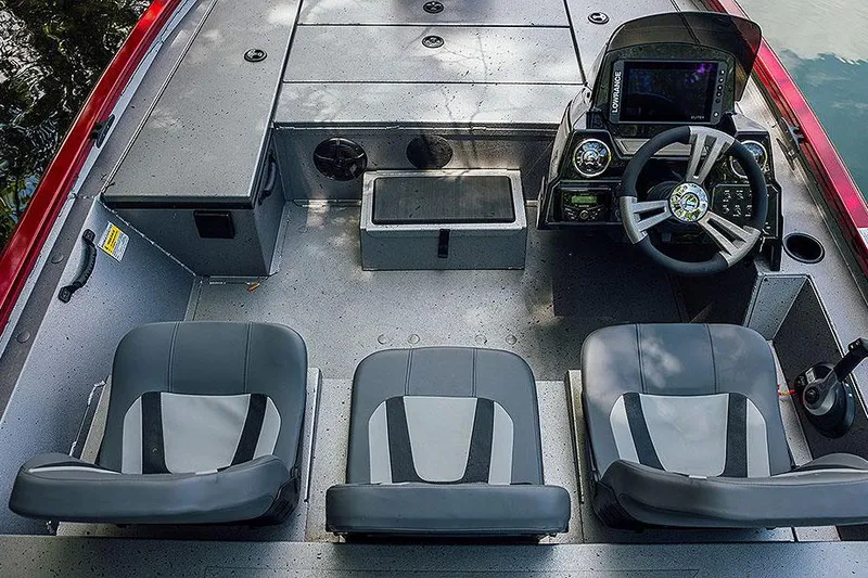 Slide: The Image of Manufacturer Provided Image: 2025 Lowe Stinger 175C boat interior with three seats and modern dashboard. - 8