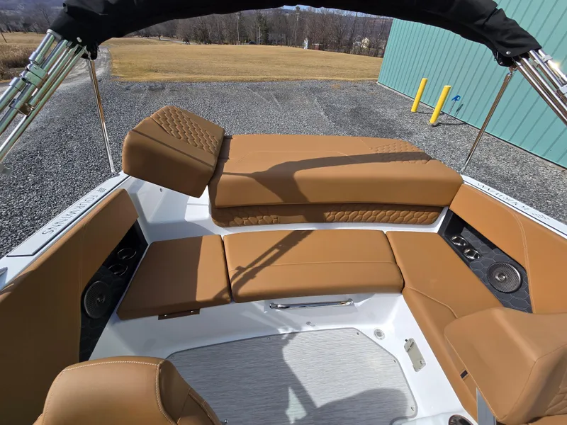 Slide: The Image of 2025 Four Winns H1 boat interior with tan seating and modern design. - 14