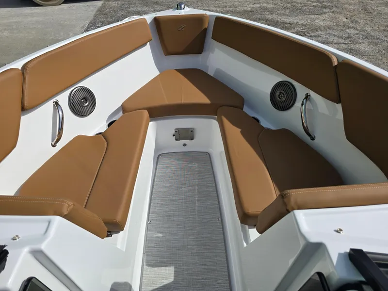 Slide: The Image of 2025 Four Winns H1 boat interior with brown seating and built-in speakers. - 20