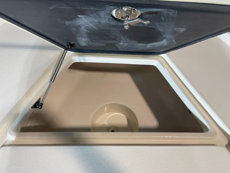 Slide: The Image of Open storage compartment on a 2021 Key West 210 Bay Reef boat. - 15