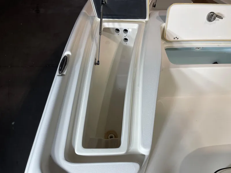 Slide: The Image of 2021 Key West 210 Bay Reef boat storage compartments and hatch detail. - 17
