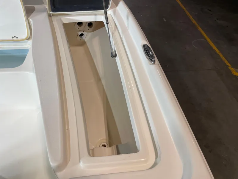 Slide: The Image of 2021 Key West 210 Bay Reef boat storage compartment, open and empty. - 18