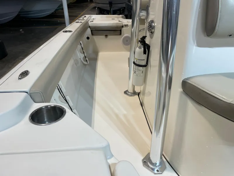 Slide: The Image of 2021 Key West 210 Bay Reef boat interior with seating and safety equipment. - 23