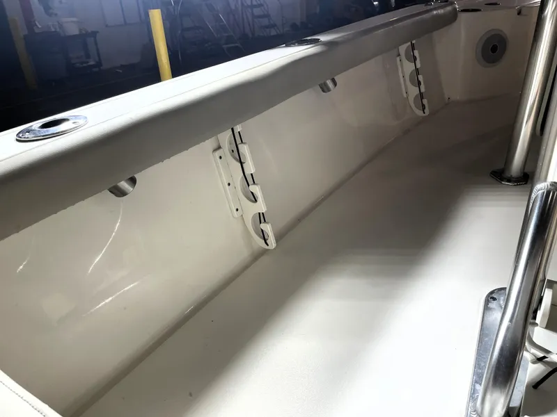 Slide: The Image of Interior view of 2021 Key West 210 Bay Reef boat, showcasing sleek design and rod holders. - 39