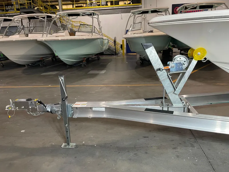 Slide: The Image of Boat trailer with Key West 210 Bay Reef, 2021 model, in a showroom setting. - 41