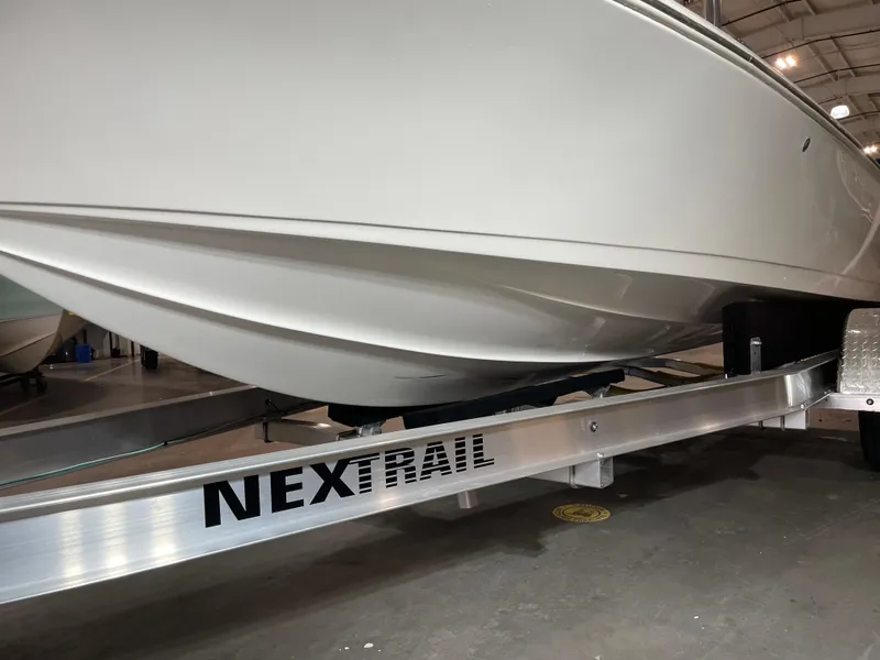 Slide: The Image of 2021 Key West 210 Bay Reef boat on Nextrail trailer in indoor storage. - 42