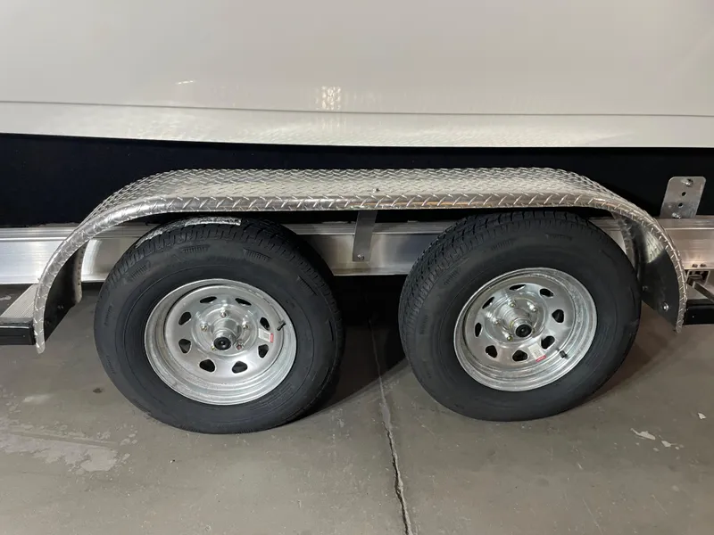 Slide: The Image of Trailer wheels of a 2021 Key West 210 Bay Reef boat. - 43