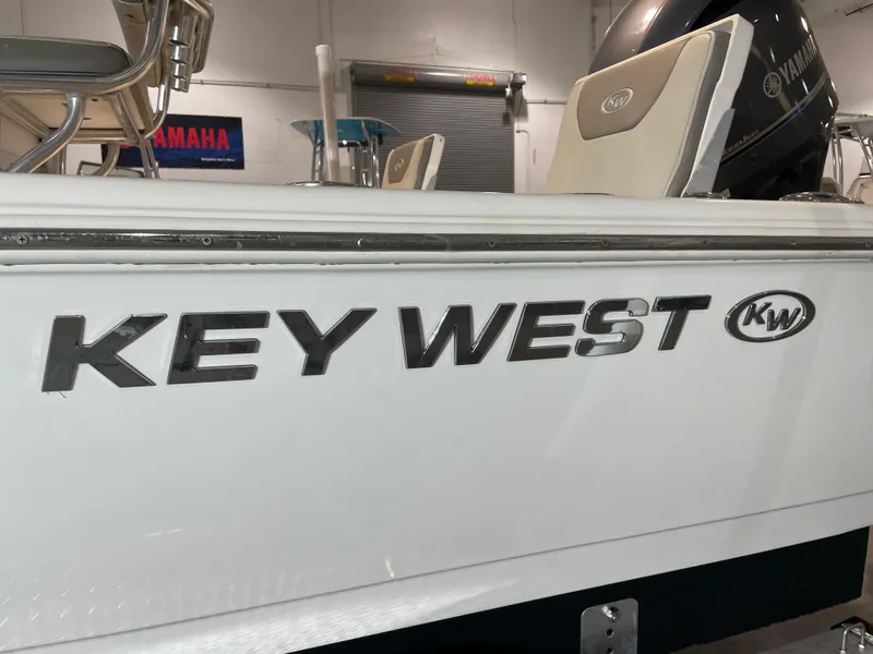 Slide: The Image of 2021 Key West 210 Bay Reef boat with Yamaha engine in showroom. - 47