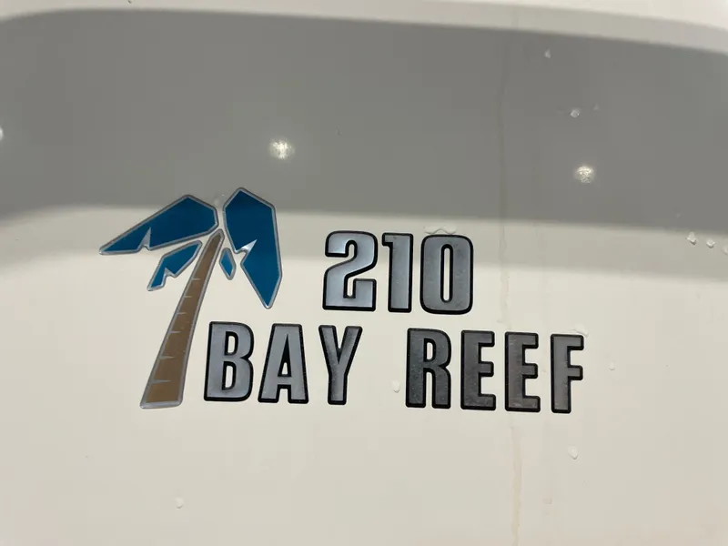 Slide: The Image of Key West 210 Bay Reef 2021 logo on boat surface. - 48
