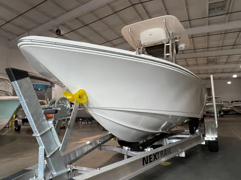 Slide: The Image of 2021 Key West 210 Bay Reef boat on trailer in indoor storage facility. - 6
