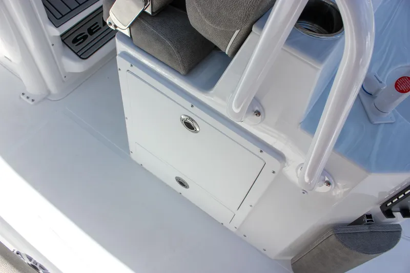 Slide: The Image of Interior view of 2026 Sea Hunt Ultra 265 SE boat, featuring seating and storage. - 10