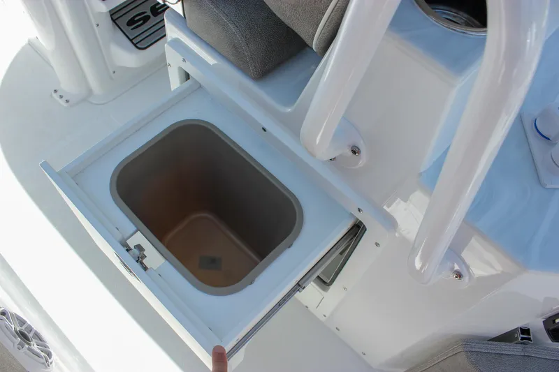 Slide: The Image of Open storage compartment on 2026 Sea Hunt Ultra 265 SE boat interior. - 11