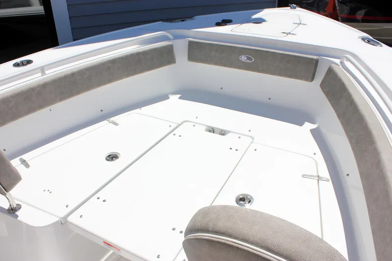 Slide: The Image of 2026 Sea Hunt Ultra 265 SE boat interior with cushioned seating and storage compartments. - 18