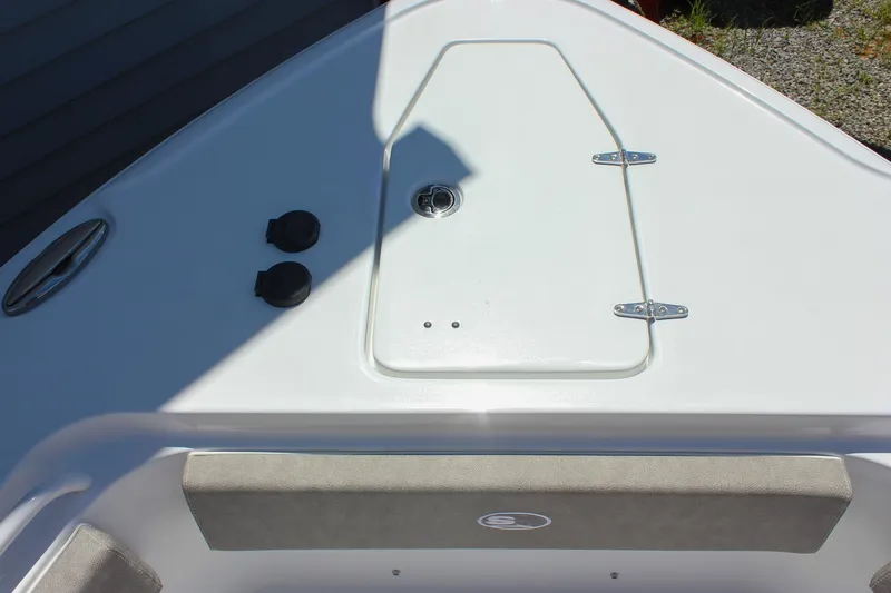Slide: The Image of Bow area of 2026 Sea Hunt Ultra 265 SE boat, featuring storage hatch and seating. - 19