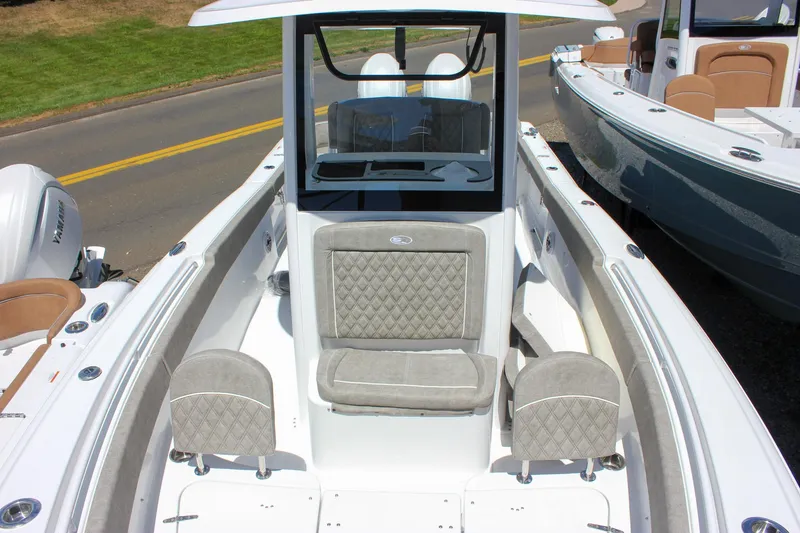 Slide: The Image of 2026 Sea Hunt Ultra 265 SE boat interior with cushioned seating and modern design. - 21