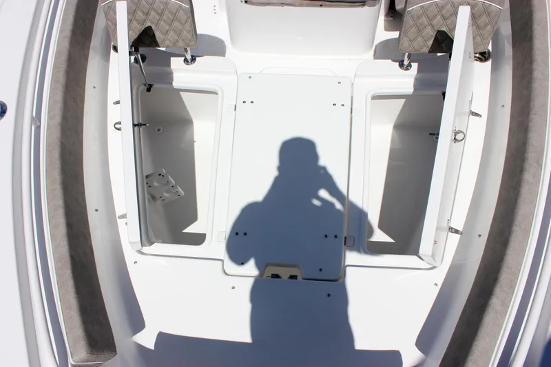 Slide: The Image of 2026 Sea Hunt Ultra 265 SE boat interior with open storage compartments. - 22