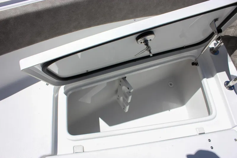 Slide: The Image of Open storage compartment on 2026 Sea Hunt Ultra 265 SE boat. - 23