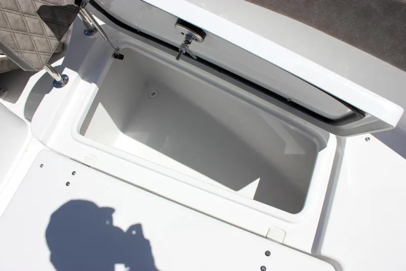 Slide: The Image of Open storage compartment on 2026 Sea Hunt Ultra 265 SE boat. - 24