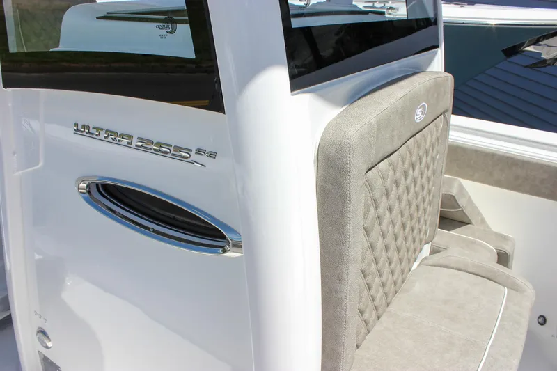 Slide: The Image of 2026 Sea Hunt Ultra 265 SE boat interior with cushioned seating and sleek design. - 25