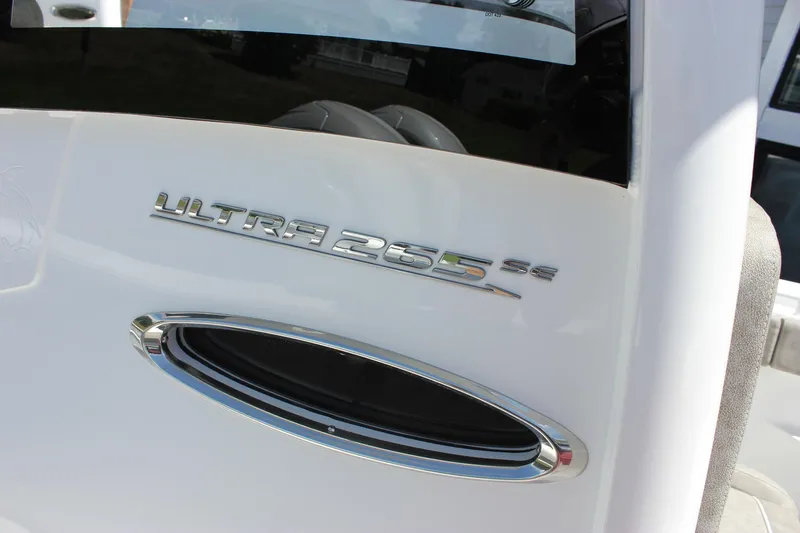 Slide: The Image of 2026 Sea Hunt Ultra 265 SE boat emblem on white surface. - 26