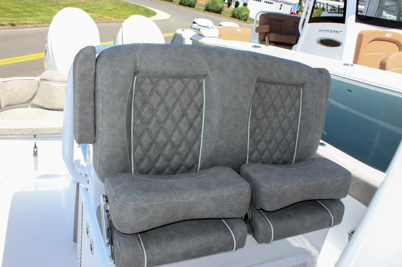 Slide: The Image of 2026 Sea Hunt Ultra 265 SE boat with luxurious gray seating and diamond stitching. - 27