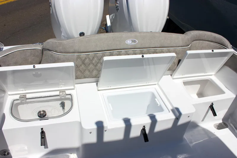 Slide: The Image of 2026 Sea Hunt Ultra 265 SE boat storage compartments and seating detail. - 29