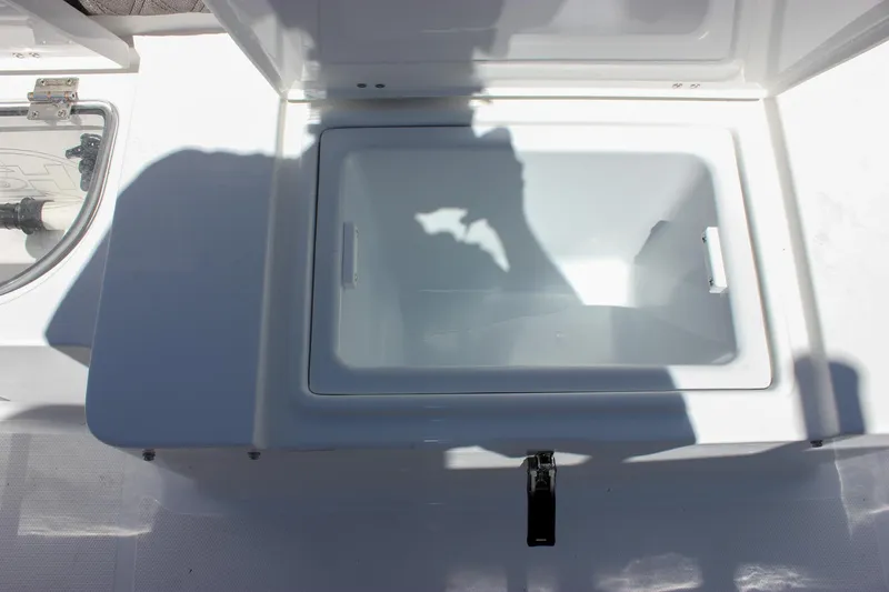 Slide: The Image of Open storage compartment on 2026 Sea Hunt Ultra 265 SE boat. - 31