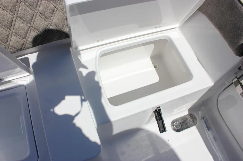 Slide: The Image of Open storage compartment on 2026 Sea Hunt Ultra 265 SE boat. - 32