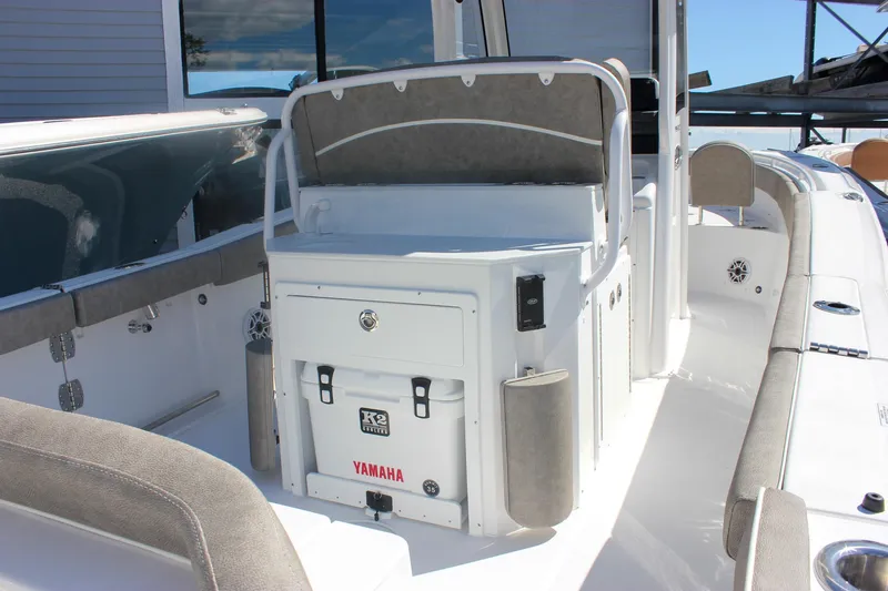 Slide: The Image of 2026 Sea Hunt Ultra 265 SE boat interior with seating and storage. - 35