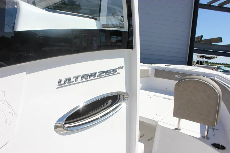 Slide: The Image of 2026 Sea Hunt Ultra 265 SE boat, sleek design with chrome detailing. - 38