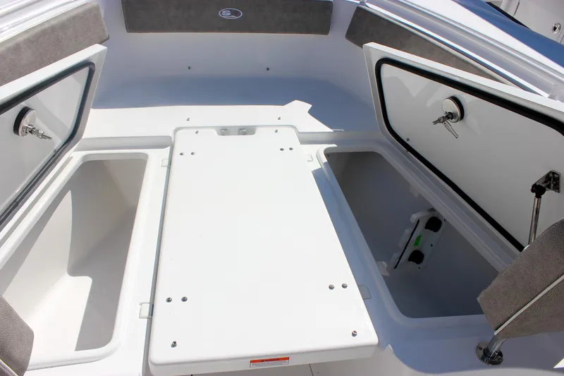 Slide: The Image of 2026 Sea Hunt Ultra 265 SE boat storage compartments with open hatches. - 39