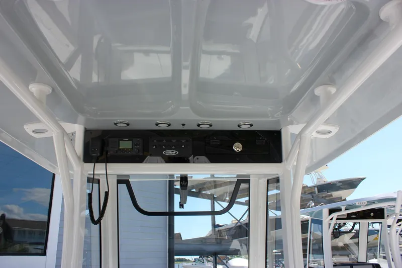 Slide: The Image of 2026 Sea Hunt Ultra 265 SE boat console with electronics and storage compartments. - 42