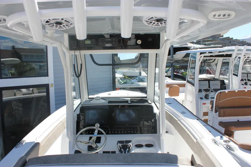 Slide: The Image of 2026 Sea Hunt Ultra 265 SE boat interior with modern dashboard and steering wheel. - 43