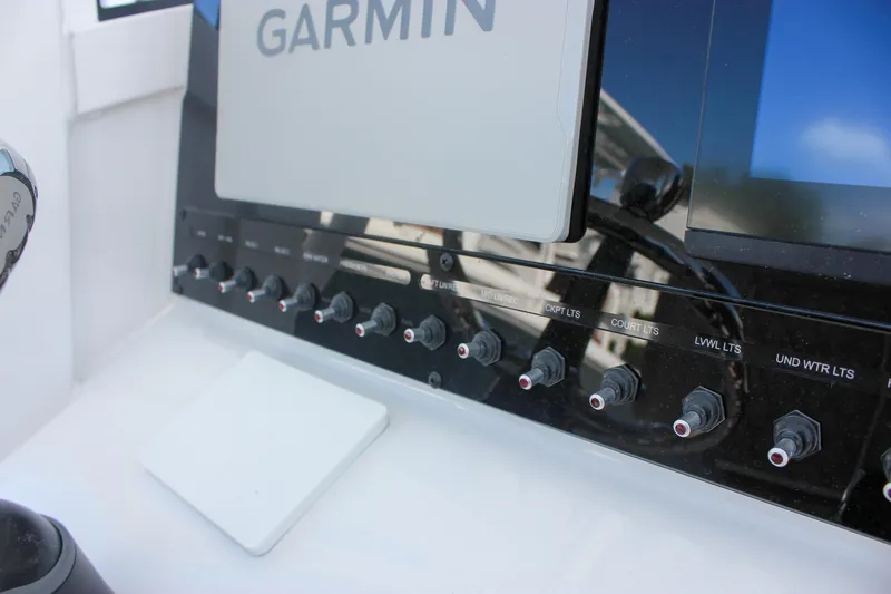 Slide: The Image of Control panel of 2026 Sea Hunt Ultra 265 SE boat with Garmin display. - 45