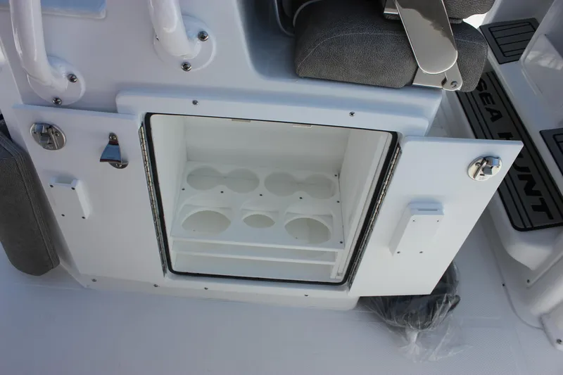 Slide: The Image of Open storage compartment on 2026 Sea Hunt Ultra 265 SE boat. - 9
