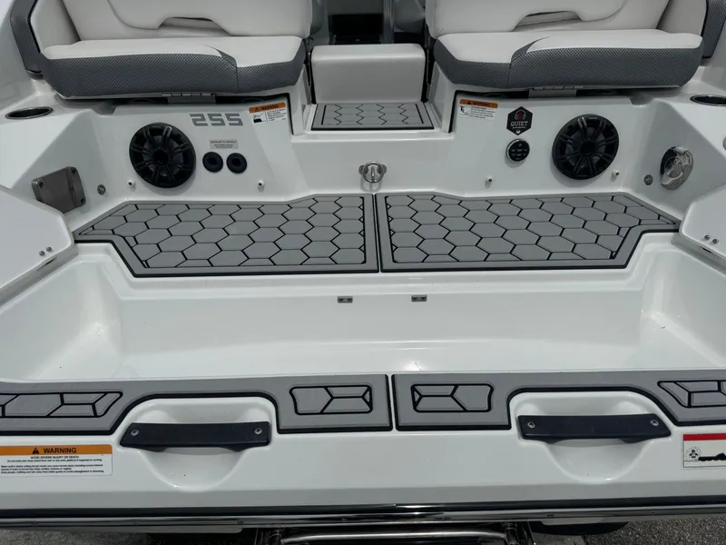 Slide: The Image of 2020 Scarab 255 Open ID boat interior with hexagonal flooring and seating. - 11