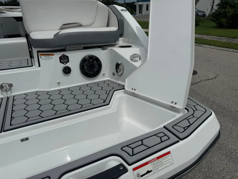 Slide: The Image of 2020 Scarab 255 Open ID boat interior with hexagonal flooring and seating. - 13