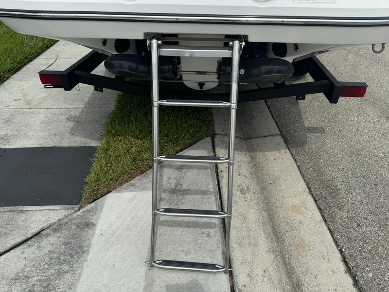 Slide: The Image of Rear view of 2020 Scarab 255 Open ID boat with extended ladder. - 14