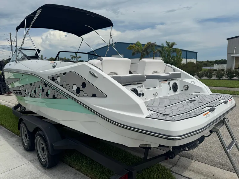 Slide: The Image of 2020 Scarab 255 Open ID boat on trailer, featuring sleek design and modern graphics. - 15