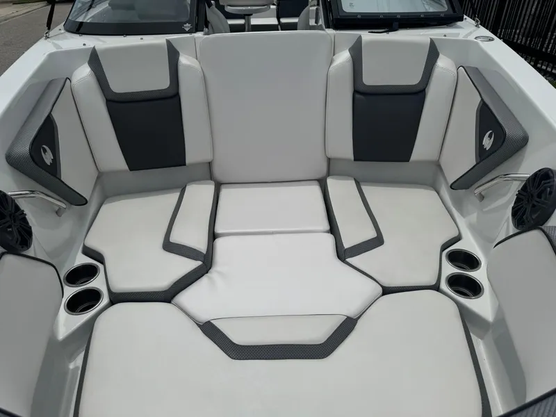 Slide: The Image of 2020 Scarab 255 Open ID boat interior with cushioned seating and cup holders. - 25