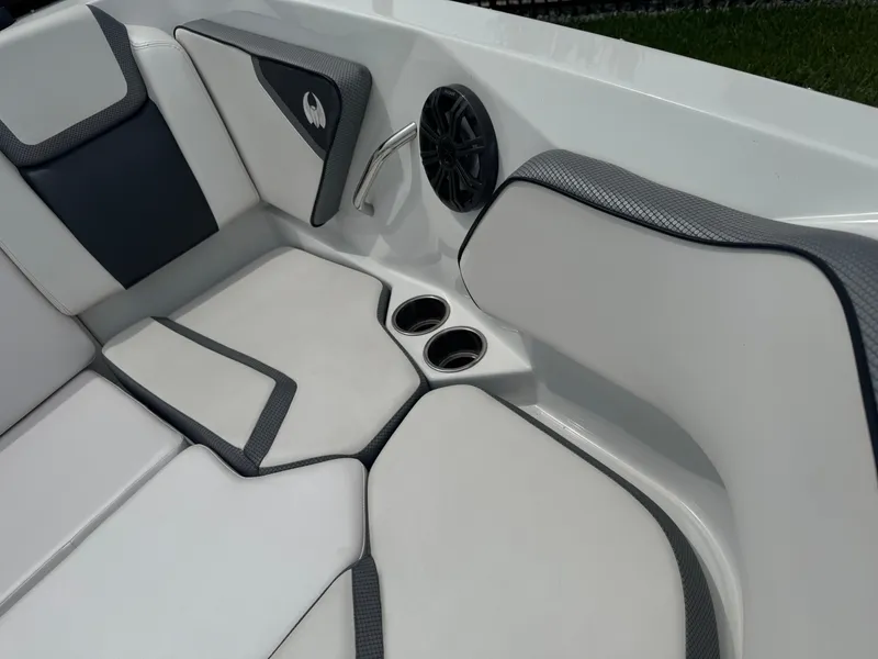 Slide: The Image of 2020 Scarab 255 Open ID boat interior with cushioned seating and cup holders. - 26
