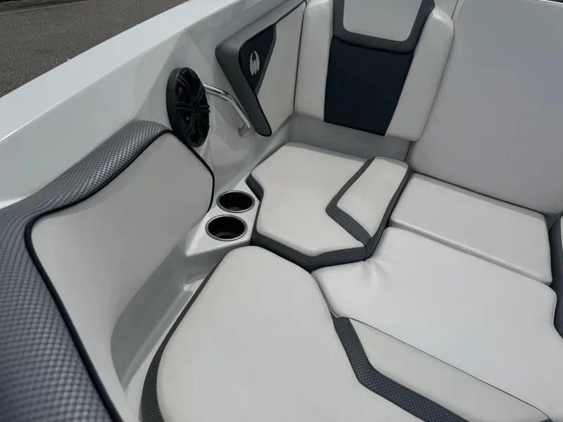 Slide: The Image of 2020 Scarab 255 Open ID boat interior with cushioned seating and cup holders. - 27