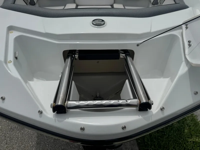 Slide: The Image of 2020 Scarab 255 Open ID boat with stainless steel ladder in storage compartment. - 28