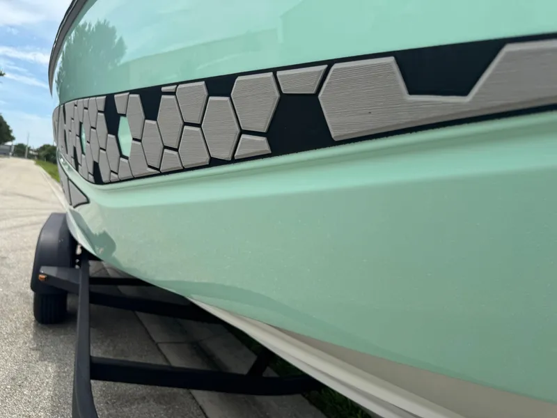 Slide: The Image of 2020 Scarab 255 Open ID boat with hexagonal design detail on the side. - 31