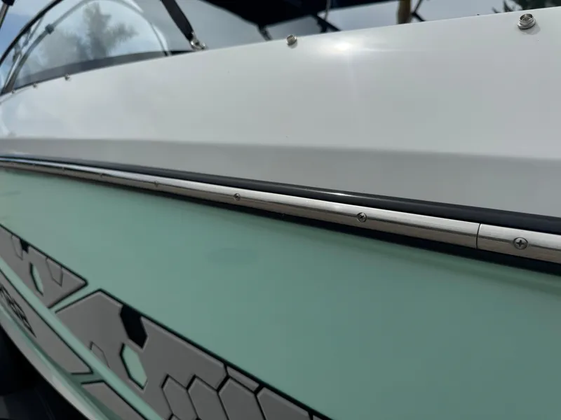 Slide: The Image of 2020 Scarab 255 Open ID boat, close-up of sleek side design and detailing. - 32