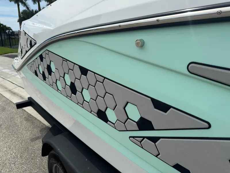 Slide: The Image of 2020 Scarab 255 Open ID boat with hexagonal pattern design on the side. - 33